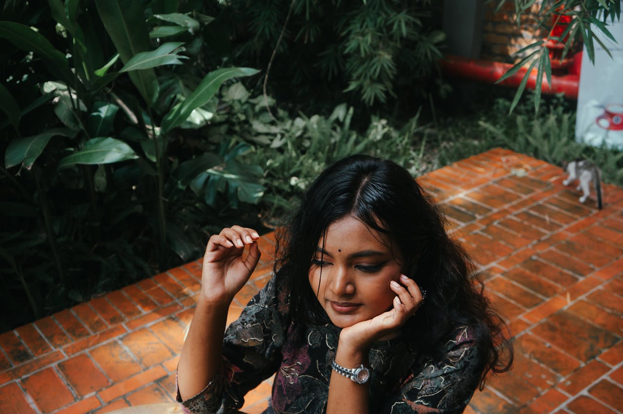 about-02 woman-relaxing-in-lush-garden-setting-outdoors-32938119